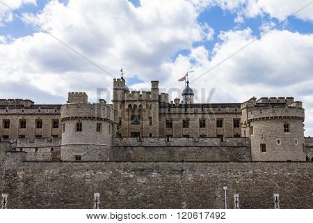 Her Majesty's Royal Palace and Fortress Tower of London historic castle on the north bank of the River Thames in central London - a popular tourist attraction.