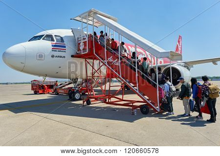 PATTAYA, THAILAND - FEBRUARY 26, 2016: people boarding Thai AirAsia A320 at U-Tapao International Airport. U-Tapao Rayong -Pattaya International Airport is serving Rayong and Pattaya cities