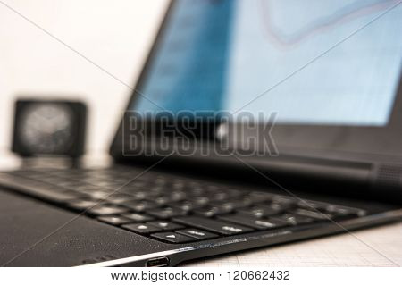 laptop with hands on wood