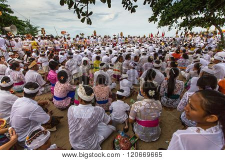 SANUR, BALI - MAR 18, 2016: Unidentified local people during performed Melasti Ritual. Melasti is a Hindu Balinese purification ceremony and ritual is held several days prior to the Nyepi holy day.