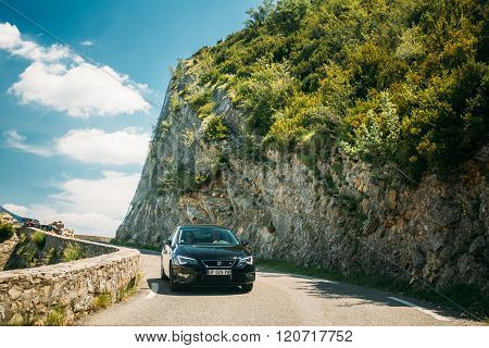 Black colour Seat Leon 5-door car on background of French mounta