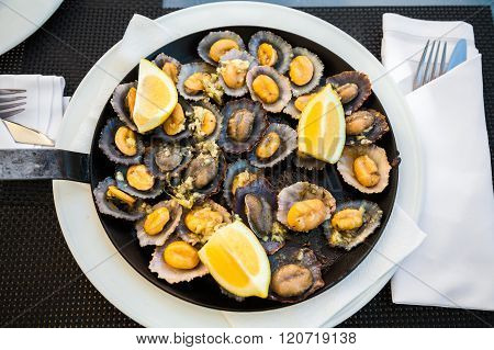 Grilled Limpets Served With Lemon