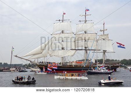 AMSTERDAM THE NETHERLANDS - AUGUST 19 2015: Clipper Sail ship 'Stad Amsterdam' in the North Sea Canal enroute to Amsterdam to particiate in the SAIL 2015 event.