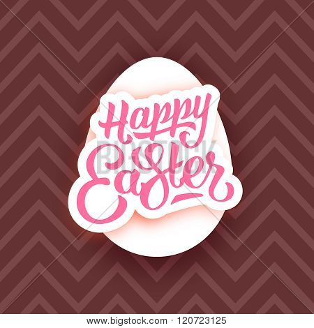 Happy Easter lettering on white egg and chocolate