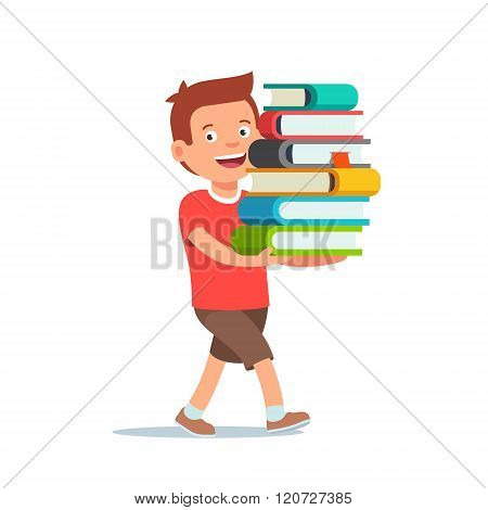 Boy walking with big pile of books in his hands