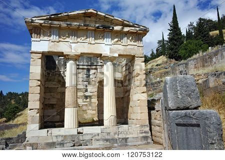 Building of Treasury of Athens in Ancient Greek archaeological site of Delphi, Greece