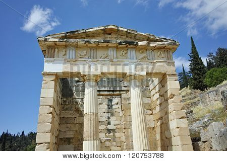 Building of Treasury of Athens in Ancient Greek archaeological site of Delphi, Greece