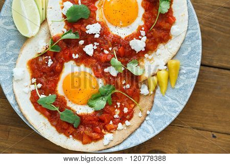Closeup Of Huevos Rancheros With Sliced Avocado