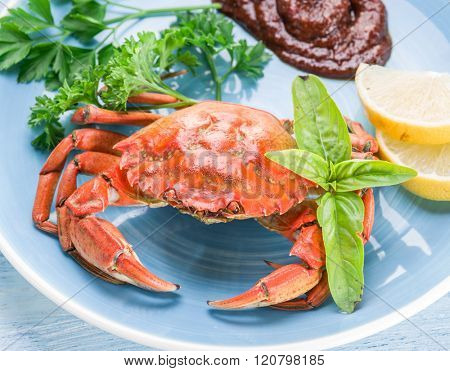 Seafood dish - cooked crab with lemon and herbs.
