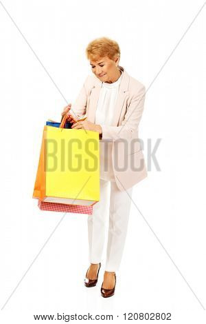 Happy business woman holging shopping bags