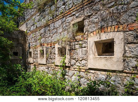 Ancient fortification wall with windows
