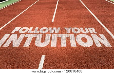 Follow Your Intuition written on running track