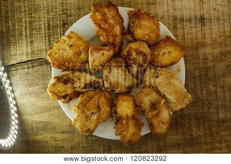 Top View Fried Pieces Of Chicken Lying On White Plate