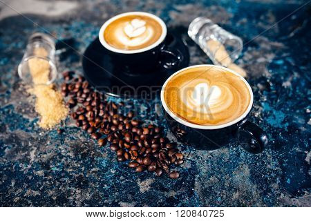 Two Cups Of Coffee With Latte Art. Barista Pouring Coffee