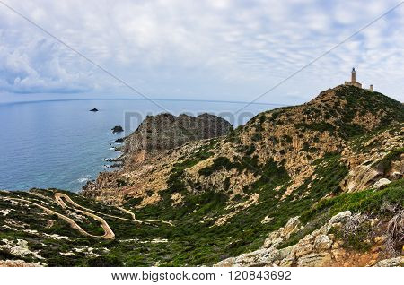 Lighthouse at Capo Sandalo on west coast of San Pietro island, Sardinia