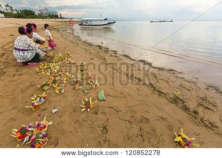 SANUR, BALI - MAR 18, 2016: Unidentified local people during performed Melasti Ritual. Melasti is a Hindu Balinese purification ceremony and ritual is held several days prior to the Nyepi holy day.
