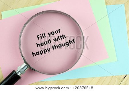 Magnifying glass on papers with inspirational words