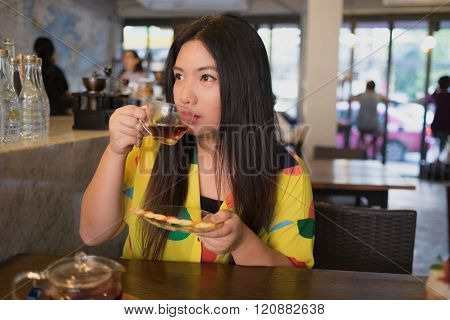 Woman Is Drinking Hot Tea