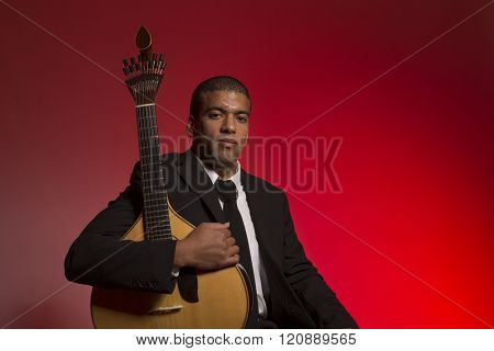 fado musician with a portuguese guitar, studio