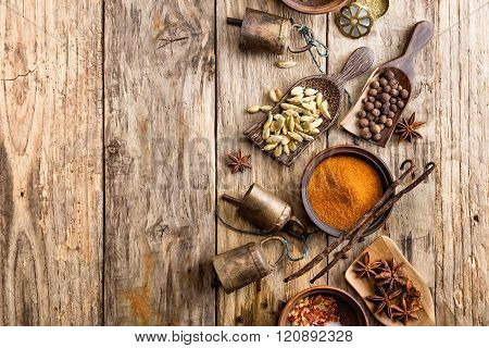 various spices on wooden background