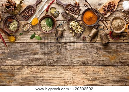 various spices on wooden background