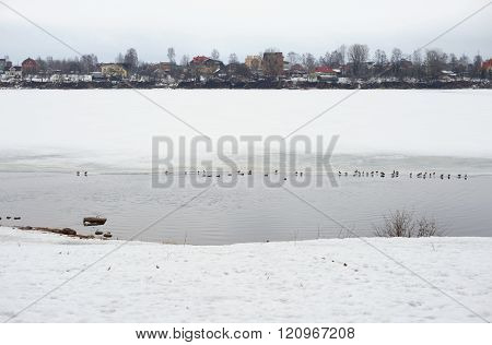 View of Neva River on the outskirts of St. Petersburg at cloud winter day Russia.