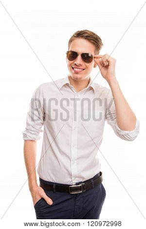 Handsome Man Touhing His Spectecles  And Holding Hand In Pocket