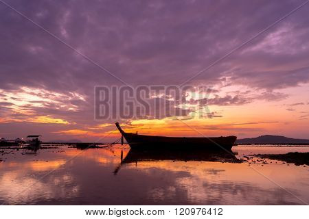 Long tail fishing boats at sunet in Thailand
