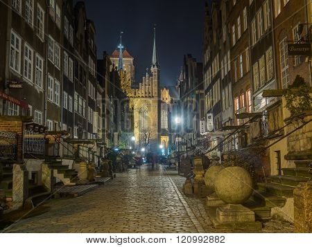Gdansk Poland - September 27 2015: A paved street of Gdansk at night illuminated by street lamps