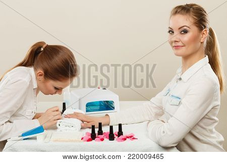 Beautician With Client At Beauty Salon.