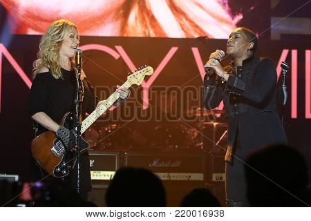 NEW YORK - NOV 29: Musician Nancy Wilson (L) and Liv Warfield perform at America Salutes You & Wall Street Rocks Presents Guitar Legends For Heroes at Terminal 5 on November 29, 2017 in New York City.