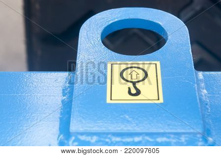 Warning sign on agricultural machinery. Place hook hook. Place of the pile.