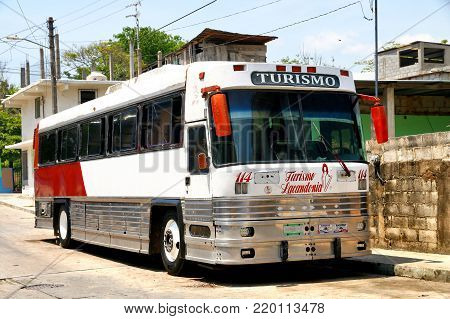 Palenque, Mexico - May 23, 2017: Interurban coach bus Dina Avante in the town street.