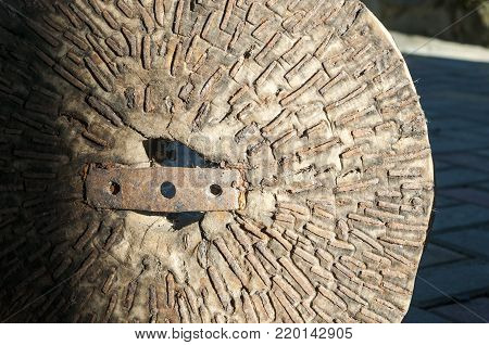 A millstone used for grinding into flour wheat and other grains, as well as grinding sometimes of any edible substances of plant and animal origin.