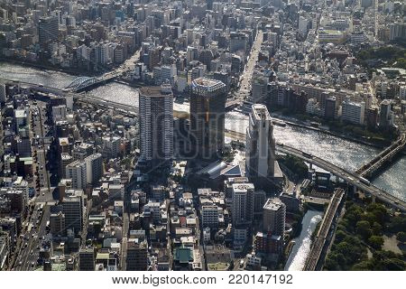 Tokyo -  Japan, June 19, 2017: Aerial view of Tokyo and the Asahi beer tower at the east bank of the Sumida River in Sumida, Tokyo 