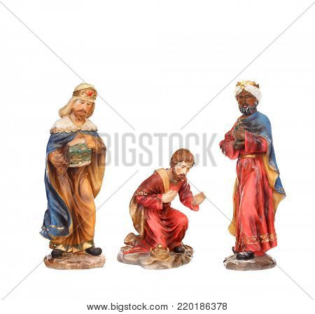 The three wise men. Ceramic figures isolated on white background