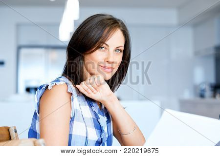 Woman with papers in their living room