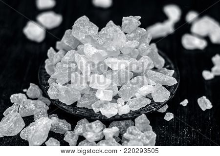 Rock Sugar Or Sugar Cubes In A Glass Plate On Wooden Surface.