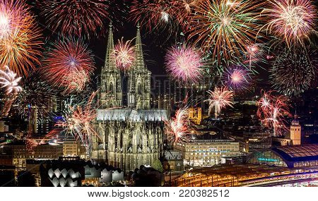 View of Cologne city at new years eve with amazing fireworks over the Cologne Cathedral. ideal for websites and magazines layouts