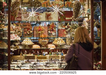PALMA DE MALLORCA, BALEARIC ISLANDS, SPAIN - DECEMBER 5, 2017: Pajarita Bomboneria store with evening Christmas light decorations on December 5, 2017 in Palma de Mallorca, Balearic islands, Spain.