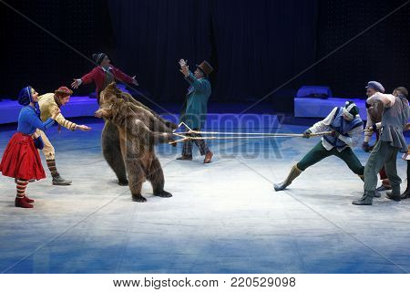ST. PETERSBURG, RUSSIA - DECEMBER 28, 2017: Actors and trained bears in the show Snow Queen by Great Moscow Circus during tis premiere in St. Petersburg. The show created by Zapashny brothers circus
