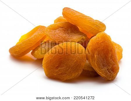 Dried apricots heap isolated on white background