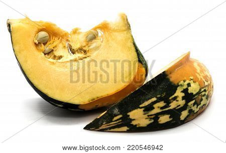 Two spotty green yellow pumpkin slices with seeds isolated on white background