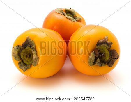 Three persimmon Kaki isolated on white background whole