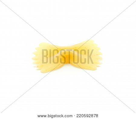 One raw farfalle pasta isolated on white background