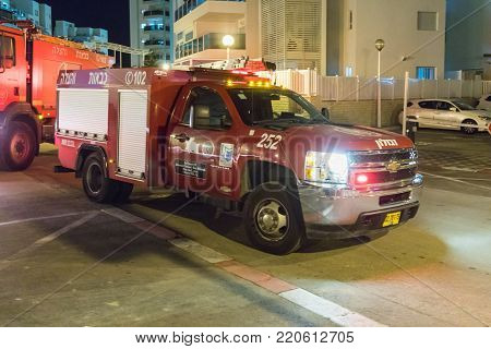 Nahariyya, Israel, November 30, 2017 : Red fire truck is standing on a city street in Nahariyya city in Israel