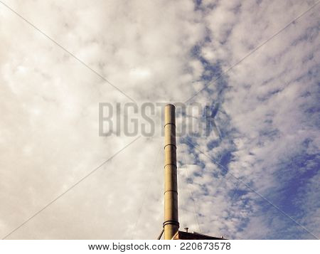 Horizontal Image of Industrial Smokestack, with Dramatic Cloudy Sky Background