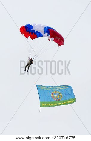 Alabino, Moskow region, Russia - July 29, 2017: Russian paratroopers demobilized with a flag walking during the Feast of Russian Air Assault Troops