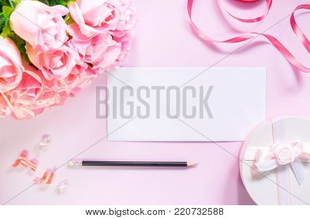 Top View Of Flat Lay Decoration Gift Box With Bow Ribbon Paper Card / Postcard And Mini Pin Heart An