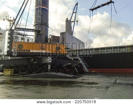 Novorossiysk, Russia - August 11, 2016: Self-propelled port crane. Mobile platform for moving the lifting mechanism.